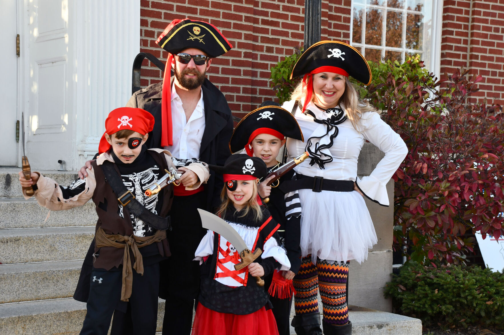 The Davis family poses as pirates